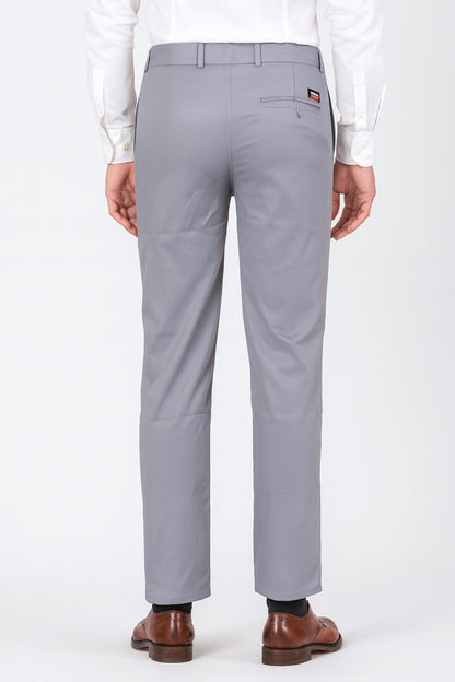Gray pants worn by a person on a white background