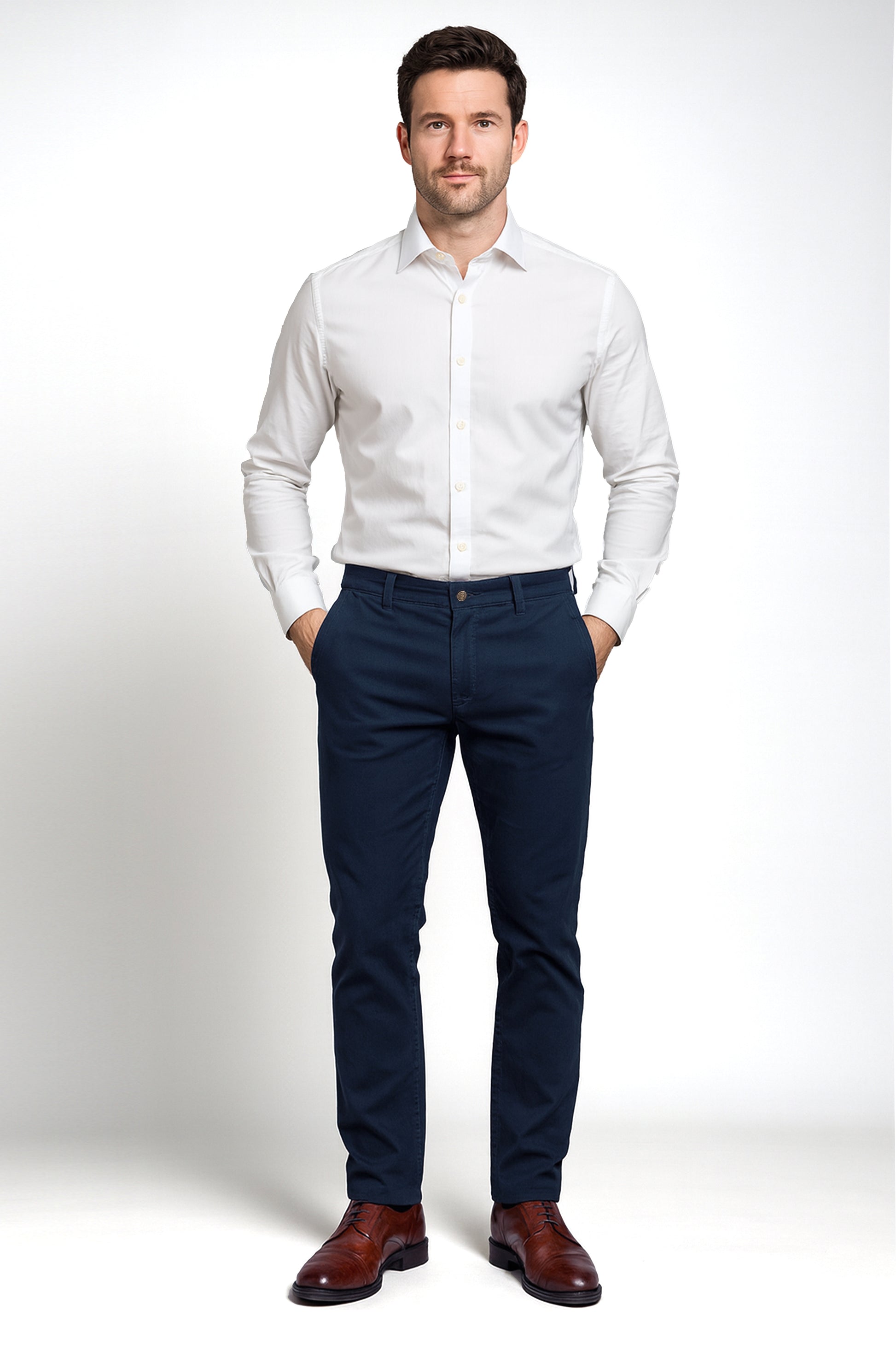 Man wearing a white dress shirt and navy pants on a white background