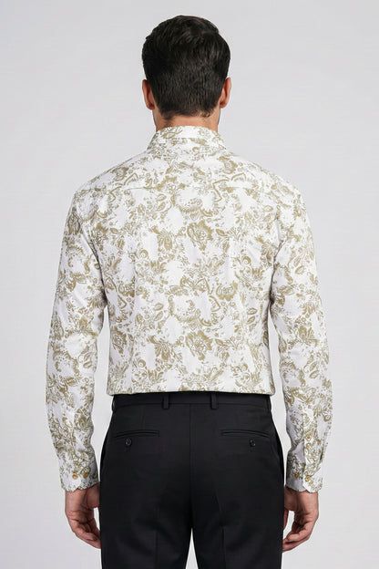 Man wearing a white floral patterned shirt and black pants on a light gray background
