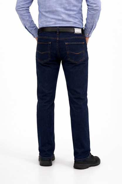 Person wearing dark blue jeans and a light blue shirt on a white background