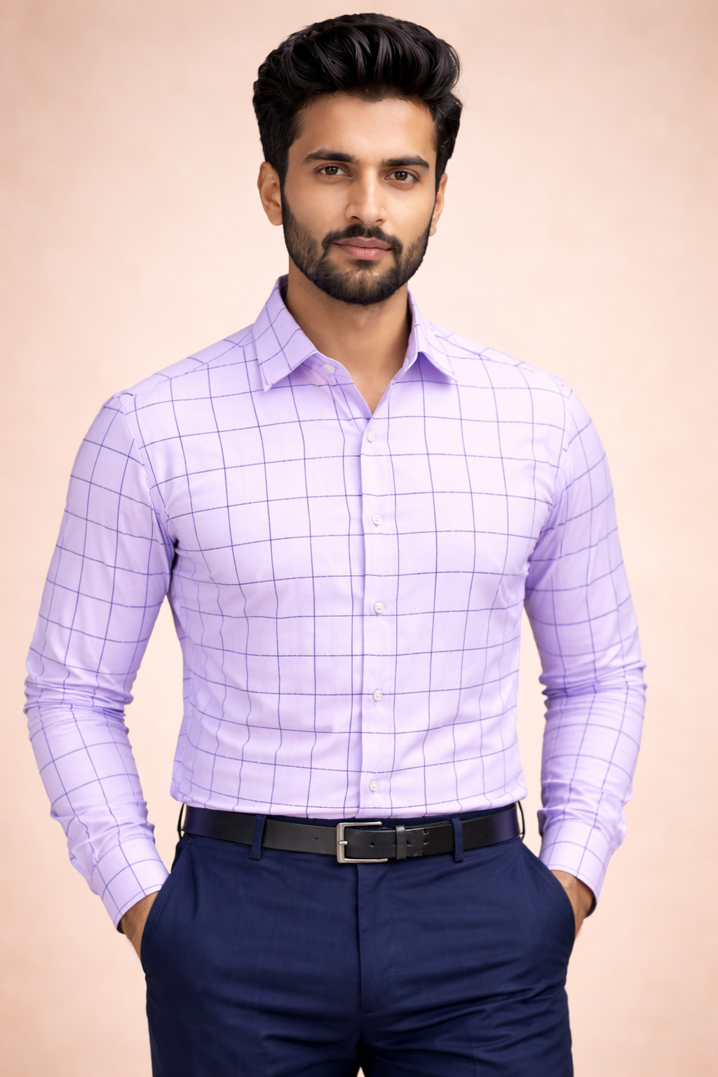 Man wearing a light purple checkered shirt and dark blue pants on a beige background
